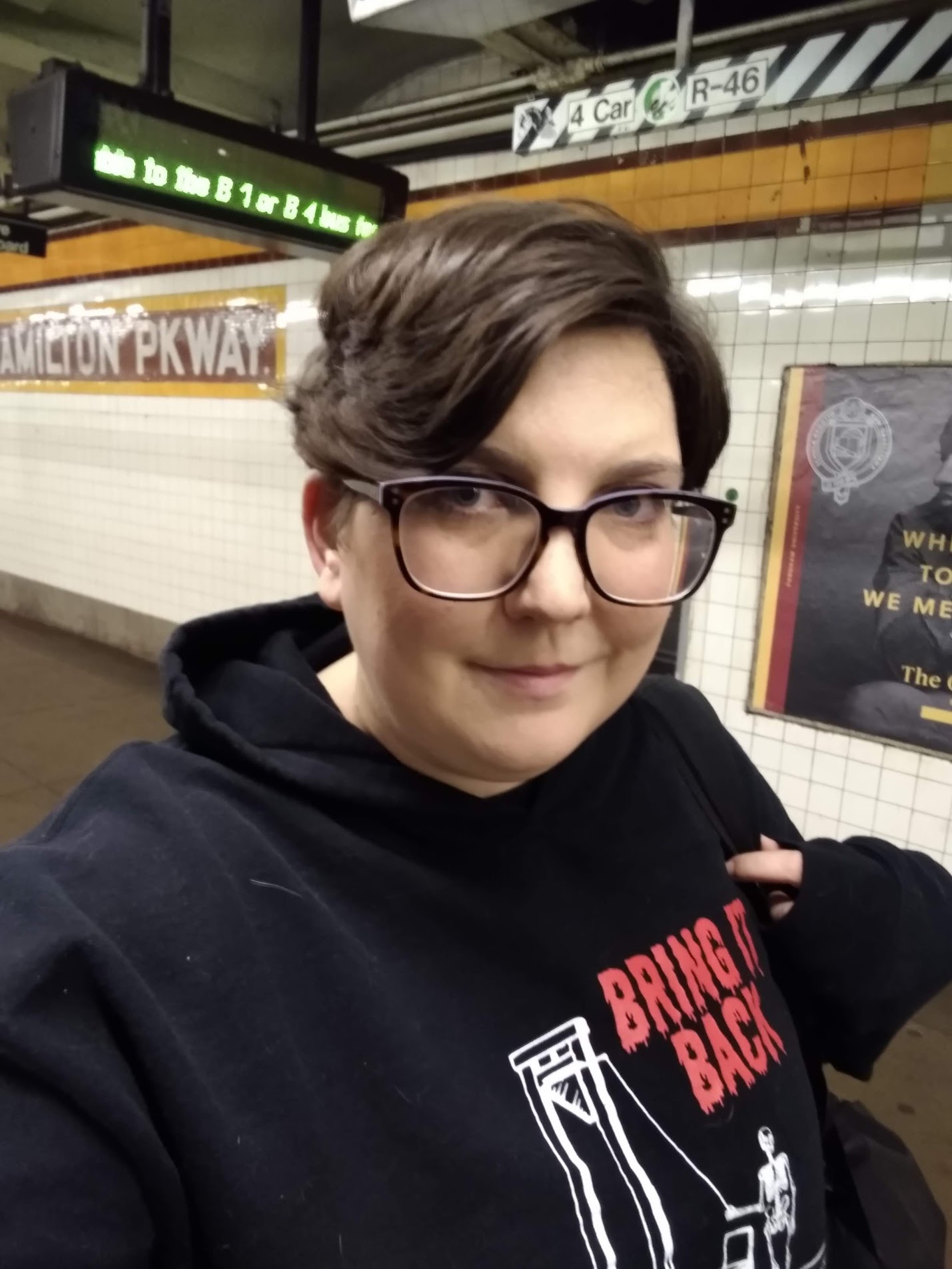 Me wearing my guillotine hoodie in the subway station